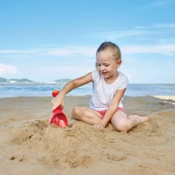 Hape Pala cavadora y rociadora Roja ·*Niños Juguetes De Playa|Juguetes De Playa